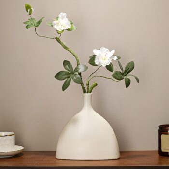 White ceramic vase, home décor, bohemian style, suitable for holding reeds.