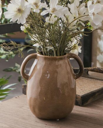 Brown ceramic vase with two handles, suitable for modern farmhouse-style home décor.